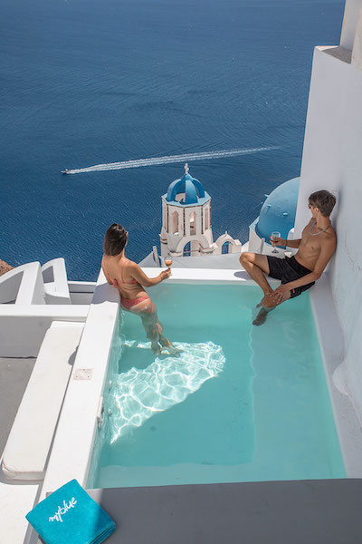 couple at Santorini Blue swimming pool